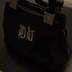 Versace hand bag with gold new